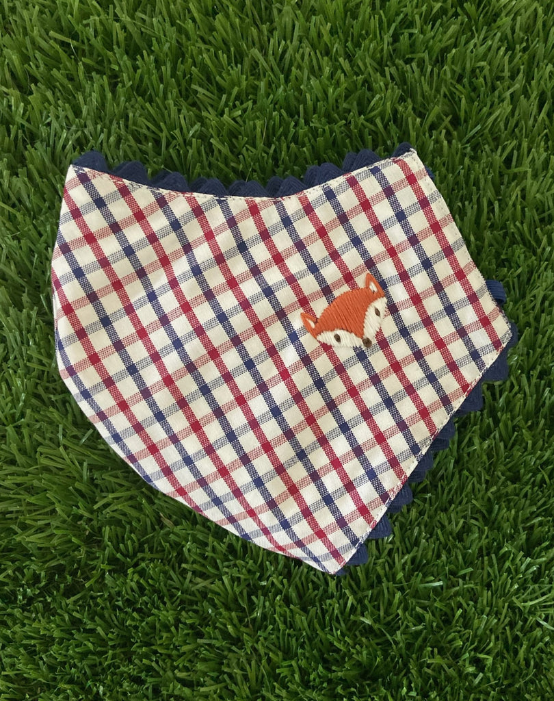 child mask with red and blue plaid and fox